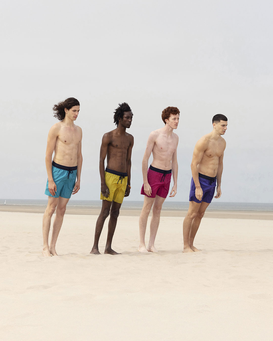 Four men on the beach